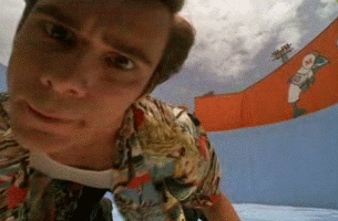 "Ace Ventura looking into the hole in the dolphin's tank"